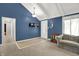Inviting living room features blue walls, white trim, and vaulted ceilings at 601 Shady Ln, Greenwood, IN 46142