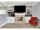 A living room featuring a fireplace, built-in shelving, and a cozy red chair at 601 Shady Ln, Greenwood, IN 46142