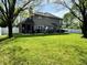 Lush backyard featuring mature trees, green grass, and a patio for outdoor entertaining at 6360 E Chapel Hill Ct, Camby, IN 46113