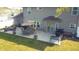 Backyard patio with dining table, patio umbrella, and barbecue at 6360 E Chapel Hill Ct, Camby, IN 46113