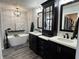 Luxurious bathroom featuring a freestanding tub, double vanities, modern fixtures, and an open closet space at 6360 E Chapel Hill Ct, Camby, IN 46113