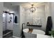 Modern bathroom showcasing a soaking tub, glass-enclosed shower, and stylish fixtures for a spa-like experience at 6360 E Chapel Hill Ct, Camby, IN 46113