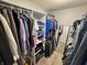 Spacious walk-in closet with organized shelves and hanging rods providing ample space for storing clothes and accessories at 6360 E Chapel Hill Ct, Camby, IN 46113