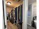 Organized walk-in closet with ample storage, shelves, and hanging space, leading to a bright, modern bathroom at 6360 E Chapel Hill Ct, Camby, IN 46113