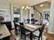 Elegant dining room featuring a stylish chandelier, modern decor, and plenty of natural light at 6360 E Chapel Hill Ct, Camby, IN 46113