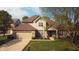 Charming two-story home with a well-manicured lawn, attached garage, and inviting front entrance at 6360 E Chapel Hill Ct, Camby, IN 46113