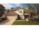 Charming two-story home with a well-manicured lawn, attached garage, and inviting front entrance at 6360 E Chapel Hill Ct, Camby, IN 46113
