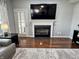 Modern fireplace with black insert, providing a focal point and cozy atmosphere in the living area at 6360 E Chapel Hill Ct, Camby, IN 46113