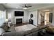 Spacious living room featuring a fireplace, hardwood floors, and seamless connection to other living areas at 6360 E Chapel Hill Ct, Camby, IN 46113