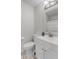 Bathroom featuring a toilet, vanity, and mirror at 7163 Cordova Dr, Indianapolis, IN 46221