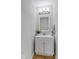 Bathroom features a sleek, modern vanity with a framed mirror and updated lighting at 7163 Cordova Dr, Indianapolis, IN 46221