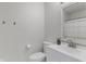 Small bathroom features a vanity, toilet, and hooks for towels at 7163 Cordova Dr, Indianapolis, IN 46221