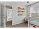 Bedroom featuring a bunk bed, chair, built in shelving, and carpeted floors at 7163 Cordova Dr, Indianapolis, IN 46221