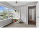 Carpeted bedroom features a large window and storage cube beneath the window at 7163 Cordova Dr, Indianapolis, IN 46221