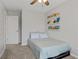 Bright bedroom features a twin bed, carpet, and built-in bookshelves at 7163 Cordova Dr, Indianapolis, IN 46221