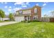 Charming two-story home featuring a well-manicured lawn and a combination of brick and siding exterior at 7163 Cordova Dr, Indianapolis, IN 46221