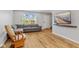 Cozy living room showcasing new wood flooring, a comfortable gray sofa, and a wall-mounted TV at 7163 Cordova Dr, Indianapolis, IN 46221