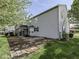 Backyard featuring a patio, fenced yard, and lush trees at 7202 Red Lake Ct, Indianapolis, IN 46217