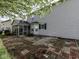 Backyard featuring a patio, fenced yard, and lush trees at 7202 Red Lake Ct, Indianapolis, IN 46217
