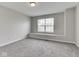 Bright bedroom with neutral walls, a large window, and soft carpet at 7202 Red Lake Ct, Indianapolis, IN 46217