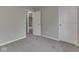 Neutral-colored bedroom features carpet flooring, neutral walls, and white doors at 7202 Red Lake Ct, Indianapolis, IN 46217