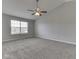 Bedroom with vaulted ceiling, ceiling fan, neutral walls, and carpeted floor with a window at 7202 Red Lake Ct, Indianapolis, IN 46217
