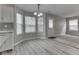 Inviting breakfast nook with modern chandelier and multiple windows for ample natural light at 7202 Red Lake Ct, Indianapolis, IN 46217