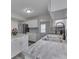 This kitchen features marble countertops, a stainless refrigerator, and modern fixtures at 7202 Red Lake Ct, Indianapolis, IN 46217
