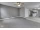 Open-concept living room boasts lots of light, neutral paint, and flows into the kitchen at 7202 Red Lake Ct, Indianapolis, IN 46217