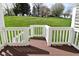 View of the expansive, well-maintained backyard from the deck, showcasing the lush greenery at 728 Christin Ct, Plainfield, IN 46168
