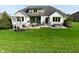 Aerial view of the home's backyard featuring patio, grill, hot tub, and lush landscaping at 728 Christin Ct, Plainfield, IN 46168