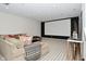 Basement with a large sectional sofa and movie screen, creating a relaxing atmosphere at 728 Christin Ct, Plainfield, IN 46168