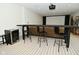 Basement featuring a wet bar, table seating, and a movie screen for entertainment at 728 Christin Ct, Plainfield, IN 46168