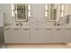 Elegant bathroom featuring dual sinks, marble countertop, and stylish lighting at 728 Christin Ct, Plainfield, IN 46168