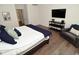 Comfortable bedroom with a TV, accent chair, and hardwood floors at 728 Christin Ct, Plainfield, IN 46168