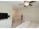 Bedroom featuring a ceiling fan, bed, and a pair of windows that provide natural light at 728 Christin Ct, Plainfield, IN 46168