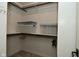 Walk-in closet with neutral carpet, shelves, and hanging rods at 728 Christin Ct, Plainfield, IN 46168
