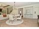Dining room features a table with seating and a built-in cabinet with mini-bar, perfect for entertaining at 728 Christin Ct, Plainfield, IN 46168