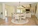 Open-concept dining area featuring a stylish round table, decorative rug and view of the living area at 728 Christin Ct, Plainfield, IN 46168