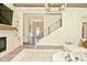 Inviting entryway offers hardwood floors, a modern staircase, and seamless transition to the rest of the house at 728 Christin Ct, Plainfield, IN 46168