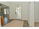 Bright foyer with tile flooring, wainscoting, and a clear view to the outside from the front door at 728 Christin Ct, Plainfield, IN 46168