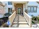 Inviting front porch with stone pillars, a decorative wreath, and a secure Pro Security sign at 728 Christin Ct, Plainfield, IN 46168