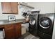 Well-equipped laundry room featuring modern washer and dryer at 728 Christin Ct, Plainfield, IN 46168