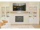 Living room view showcases the fireplace with built-in shelving, offering a relaxing space for Gathering and guests at 728 Christin Ct, Plainfield, IN 46168