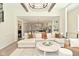 Open-concept living room flows into the kitchen, creating a spacious and welcoming environment with hardwood floors at 728 Christin Ct, Plainfield, IN 46168