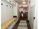 Spacious mudroom with built-in bench, coat hooks and tile floors at 728 Christin Ct, Plainfield, IN 46168
