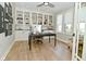Bright office with built-in shelving, hardwood floors, and natural light at 728 Christin Ct, Plainfield, IN 46168