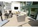 Back patio featuring outdoor furniture and a mounted television at 728 Christin Ct, Plainfield, IN 46168