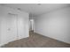 Bedroom featuring carpet flooring, white trim and walls, and double door closet at 7417 Waylon Way, Indianapolis, IN 46239
