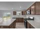 Bright kitchen with stainless steel appliances, center island, and sleek countertops at 7417 Waylon Way, Indianapolis, IN 46239